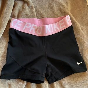 Black Nike Pro Shorts with pink waistband